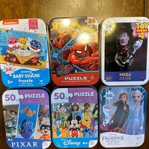 Variety puzzles in small metal tins